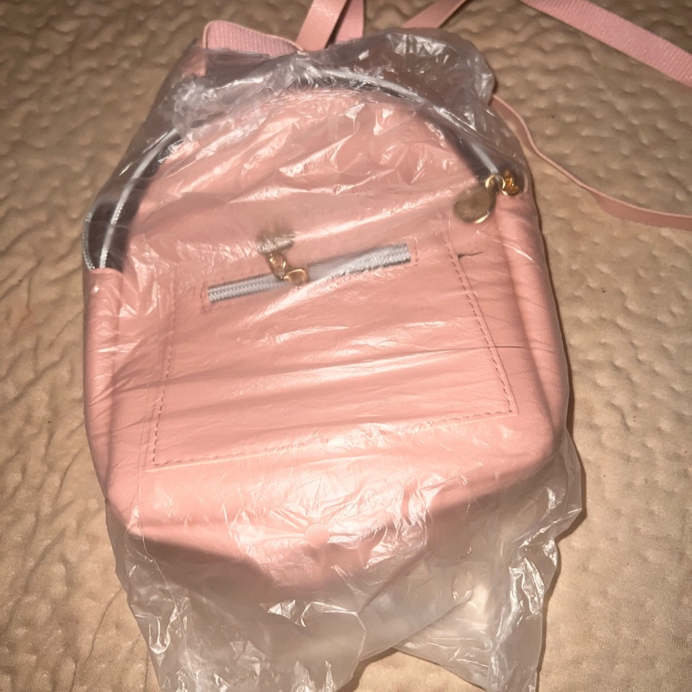 Small pink backpack brand new unopened.